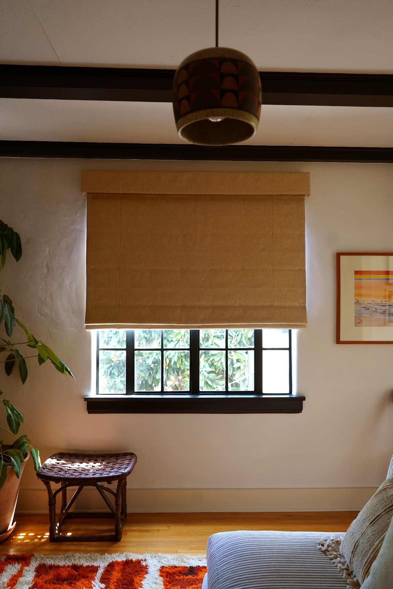 Linen Roman shade in a quiet interior